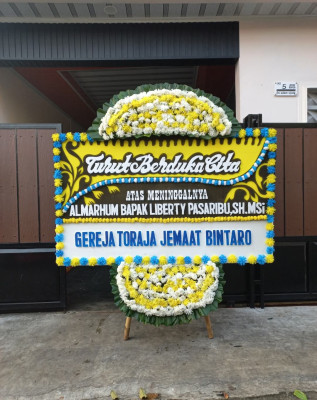 Papan Bunga Duka di Pulau Kelapa
